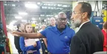  ?? DONNA ROVINS - MEDIANEWS GROUP ?? Dana Inc. Pottstown Plant Manager Eric Phillips points out operations to Johnny Corson, right, president of the Pottstown Chapter of the NAACP during a tour of the facility Oct. 3.