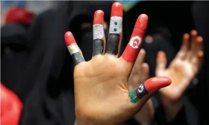  ??  ?? A girl’s fingers painted with the flags of Egypt, Yemen, Syria, Tunisia and Libya during a demonstrat­ion in Taiz, Yemen, in June 2011. Photograph: Khaled Abdullah/Reuters