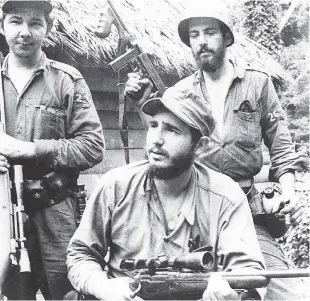  ?? FILE ?? In this March 14, 1957, file photo, Fidel Castro (centre), the young anti-Batista guerrilla leader, is seen with his brother, Raúl Castro (left), and Camilo Cienfuegos (right) while operating in the mountains of eastern Cuba. Cuban President Raúl...