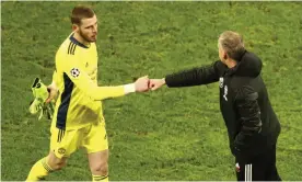  ??  ?? David de Gea (left) has been backed by Ole Gunnar Solskjær. Here they bump fists after Manchester United’s Champions League exit at Leipzig. Photograph: Matthias Schräder/AP