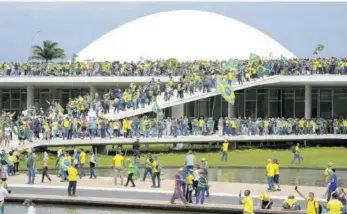  ?? (Photo: AP) ?? Protesters, supporters of Brazil’s former President Jair Bolsonaro, storm the National Congress building in Brasilia, Brazil, Sunday, January 8, 2023.
