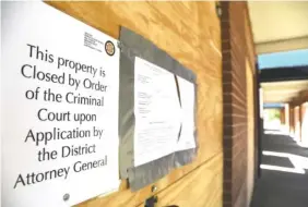  ?? STAFF PHOTO BY ANGELA LEWIS FOSTER ?? The Westside Shop was padlocked after District Attorney General Neal Pinkston said it became a hotbed of criminal activity.