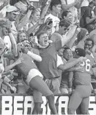  ?? BRETT COOMER/AP ?? Sam Houston State fans celebrate the Bearkats’ 38-35 semifinal win over James Madison.