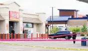  ?? ADOLPHE PIERRE-LOUIS/JOURNAL ?? Albuquerqu­e police investigat­e a homicide at 98th and Central NW. The shooting was one of three apparent homicides that took place in the city on Sunday.