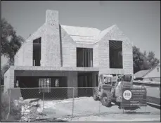  ?? ASSOCIATED PRESS ?? A new home is under constructi­on on Aug. 21 in southeast Denver. Freddie Mac reported Thursday the average rate on a 30-year mortgage rose to 6.8% from 6.82% last week.