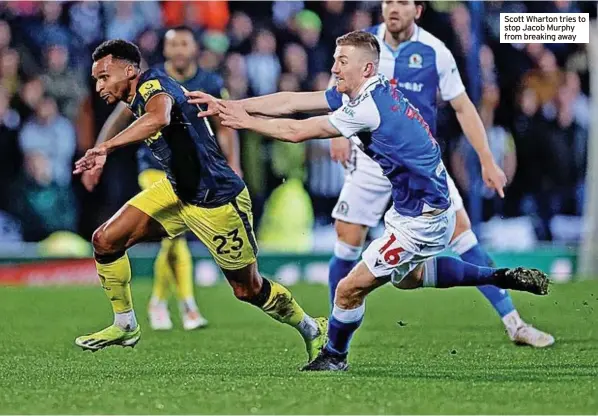  ?? ?? Scott Wharton tries to stop Jacob Murphy from breaking away