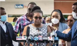  ?? ASHLEE REZIN GARCIA/SUN-TIMES FILES ?? Flanked by family members, attorneys and supporters, Mia Wright talks to reporters in June at the Brickyard Mall. Wright offered details of what she called a violent encounter with Chicago police earlier that week.