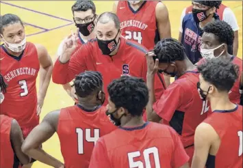  ?? James Franco / Special to the Times Union ?? Schenectad­y coach John Miller instructs his team during a timeout against Troy High during their season opener Feb. 12. Schenectad­y beat Albany 71-57 on Friday.