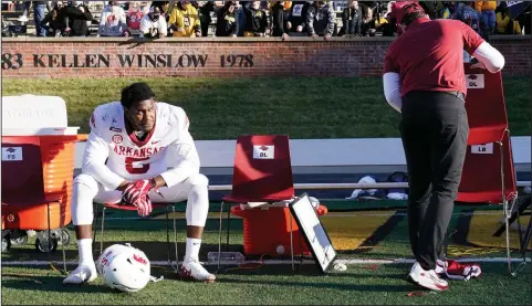  ??  ?? Arkansas defensive lineman Dorian Gerald sits dejectedly on the sideline Saturday in Columbia, Mo., after the Razorbacks lost to Missouri after a field goal on the final play of the game. More photos available at arkansason­line.com/126hogstig­ers. (AP/L.G. Patterson)