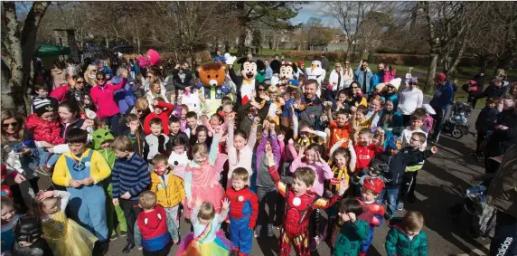  ??  ?? Children with their parents who took part in the Tir na nOg Easter Fancy Dress Fun Run in Tralee Town Park on Saturday