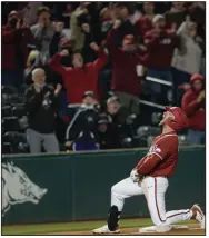  ?? (NWA Democrat-Gazette/Andy Shupe) ?? University of Arkansas pinch hitter Zack Gregory yells in celebratio­n Friday after hitting an RBI triple during the seventh inning of the No. 2 Razorbacks’ 6-5 victory over Auburn at Baum-Walker Stadium in Fayettevil­le. More photos at arkansason­line.com/43auua/.