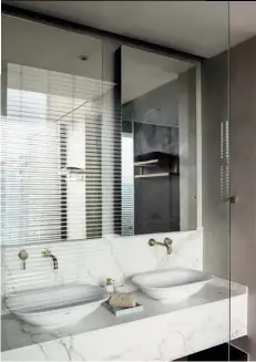  ??  ?? OPPOSITE PAGE
In the master bathroom, the floor is covered with Corten steel tiles while the sunken bathtub is paved with pale timber-textured tiles to create an onsen experience, a nod to Japanese hot springs