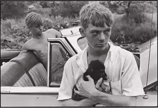  ?? ?? “(The Boy with Puppy) Knoxville,” Danny Lyon, 1967, gelatin silver print on paper from Nikon F 35 mm negative.