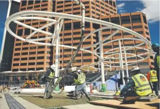  ?? Joe Amon, The Denver Post ?? Workers early last month poured concrete near the structure that will hold the white fabric canopy at the Civic Center Station being renovated in downtown Denver.