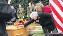  ?? PHOTO: JOHN COSGROVE ?? Home at last . . . Kathy Wright, sister of Corporal Allister George Buchanan, says farewell at the graveside in Wallacetow­n.