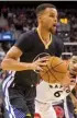  ?? Associated Press ?? Golden State Warriors’ Stephen Curry drives past the Toronto Raptors during the second half Saturday in Toronto.