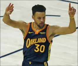  ?? RICK BOWMER — THE ASSOCIATED PRESS ?? Warriors guard Stephen Curry celebrates Saturday night after hitting a 3-pointer and matching Reggie Miller for second on the all-time list. He passed Miller later in the game.