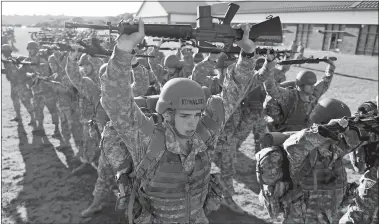  ?? SEAN D. ELLIOT/THE DAY ?? Officer Candidate Alexander Kowalski and his classmates go through “Lines of Knowledge” drills Wednesday before breakfast during Phase One of Officer Candidate School.