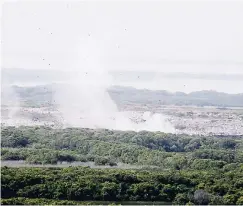  ?? NORMAN GRINDLEY/CHIEF PHOTO EDITOR ?? Smoke still coming from a section of the Riverton dump in St Andrew yesterday after a fire ignited at the dump last Wednesday night.