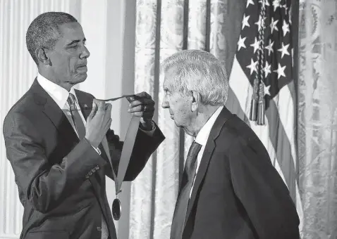  ?? Getty Images file photo ?? President Barack Obama presents the National Humanities Medal to author Larry Mcmurtry at the White House in 2015. Mcmurtry had a gift for quietly representi­ng modes of life in Texas undergoing change, and his novels were the basis for the films “Terms of Endearment,” “The Last Picture Show” and “Hud.” Regarded as one of the greatest Texas storytelle­rs, he had works that spanned six decades.