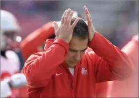  ?? NICK WASS - THE ASSOCIATED PRESS ?? In this Saturday, Nov. 17, 2018photo, Ohio State head coach Urban Meyer holds his hands to his head before an NCAA football game against Maryland in College Park, Md.