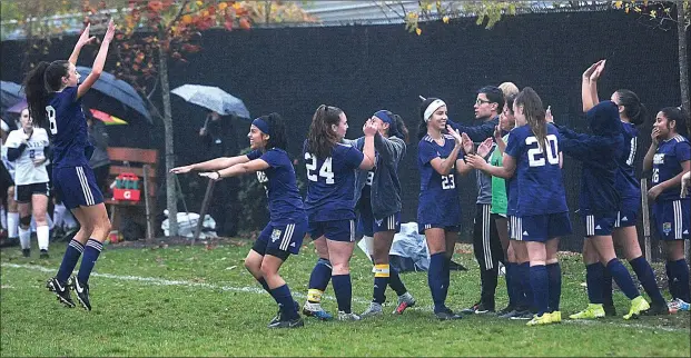  ??  ?? The No. 8 Blackstone Valley Prep girls soccer team celebrates after earning its first playoff victory in program history, a 2-1 Division
III preliminar­y round victory over No. 9 Davies Wednesday.