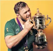  ??  ?? Sweet success: Duane Vermeulen takes a bite of the Webb Ellis Cup after South Africa’s World Cup victory over England in Yokohama last year, where the back-row forward was named player of the match