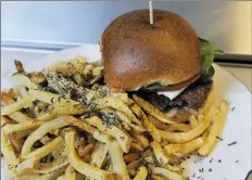  ?? Nate Guidry/Post-Gazette ?? Burgh’ers is offering two craft burgers and fries for $20.18.