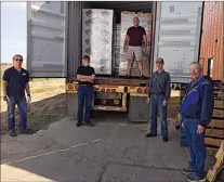  ?? SUBMITTED PHOTO ?? Members of Prairie Gleaners stand with a 40-foot container, which was packed with dehydrated soup mix and shipped to Zambia through Dynamic Churches Internatio­nal and Saskatoon’s Bare Foot Ministries on May 7.