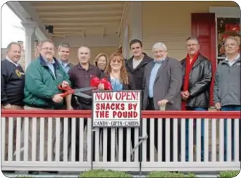  ??  ?? Cutting the ribbon on ìSnacks by the Poundî are, from left, Paul Salvatore (Newtown Corporatio­n), Mick Petrucci (Newtown Business Associatio­n), Frank Brassell (Newtown Corporatio­n), owners Larry Laiken, Judy Fiume and Tracey Laiken, U.S. Congressma­n...