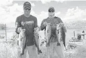  ?? SKIP REED/COURTESY ?? Steven Forssell, left, and Rodd Sayler caught five bass weighing a total of 26.05 pounds Sunday, including the big bass of 6.7, to win the Bass-N-Fools 38th annual Spring Fling tournament at Everglades Holiday Park.