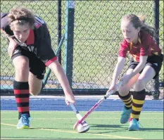  ??  ?? IN DISPUTE: Cade Dodson, left, of Horsham Bombers and Maggie Butcher, Warrack Revengers, contest the ball. Picture: JOHN O’DWYER