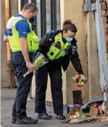  ??  ?? Top, the BMW after crash. Above, police lay flowers and, right, grief at scene