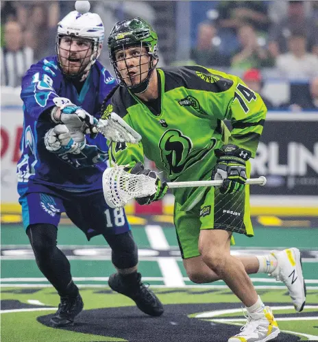  ?? LIAM RICHARDS/THE CANADIAN PRESS ?? Saskatchew­an transition player Jeremy Thompson, right, and Rochester defender Jake Withers vie for the ball during the third quarter of Game 1 of the National Lacrosse League finals in May. Thompson had six goals and nine assist in 18 games last season