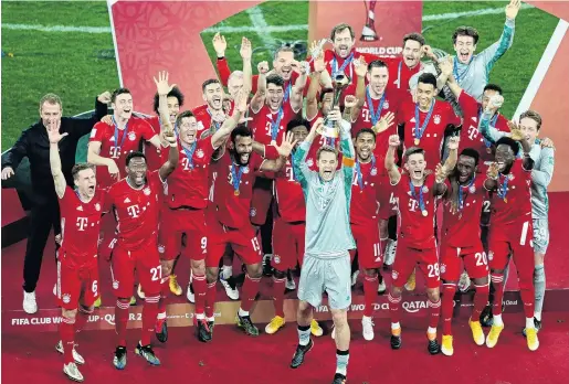  ?? PHOTO: REUTERS ?? On top of the world . . . The Bayern Munich players celebrate with the trophy after beating Tigres UANL to win the Club World Cup in Al Rayyan, Qatar, yesterday.