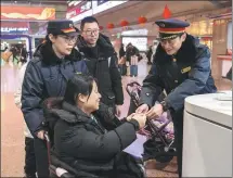  ?? PROVIDED TO CHINA DAILY ?? Staff from Beijing West Railway Station provide services for passengers on Friday. The station has two special waiting rooms designated for those needing special assistance, such as the disabled, expectant moms and small children.