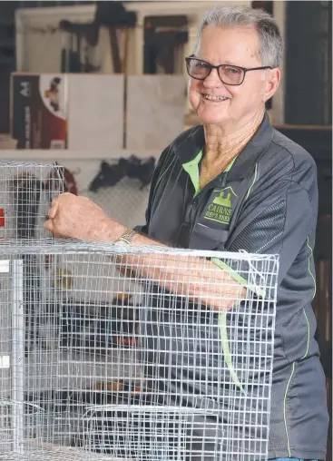  ?? Picture: ANNA ROGERS ?? SERIOUSLY EFFECTIVE: Cairns Men’s Shed myna bird trap co-ordinator Ron Moon with one of the traps made by volunteers.