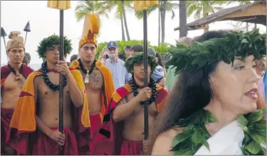  ??  ?? Performers arrive for the luau at King Kamehameha’s Kona Beach Hotel. It’s rated as the best by locals.