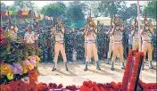  ?? PTI ?? Security personnel pay tribute to a CRPF jawan during his funeral ceremony at Dharmanaga­r, Tripura, on Tuesday.