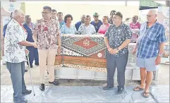  ?? Picture: LUKE RAWALAI ?? Permanent secretary for the Office of the Prime Minister Yogesh Karan (second from left) meets a coconut farmer in Savusavu during the launch of the new steel food grade expeller.