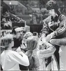  ?? TIMES PHOTOS BY JOHN SOTOMAYOR / THE NEW YORK ?? Sandy Dunn, the New York Chiefs’ women’s team captain, signs autographs at Madison Square Garden in New York in 1972.