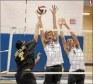  ?? GENE WALSH — DIGITAL FIRST MEDIA ?? Dock’s Dan Moyer and Sam Gingerich go up to block Bethlehem Catholic’s Nick Greenawalt.