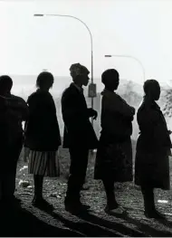  ?? ?? Voters line up to vote in South Africa’s first democratic elections in 1994.