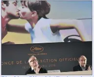  ?? (Photo AFP) ?? Thierry Frémaux (ici à gauche), et Pierre Lescure devant l’affiche du e Festival de Cannes, lors de la présentati­on de la sélection officielle.