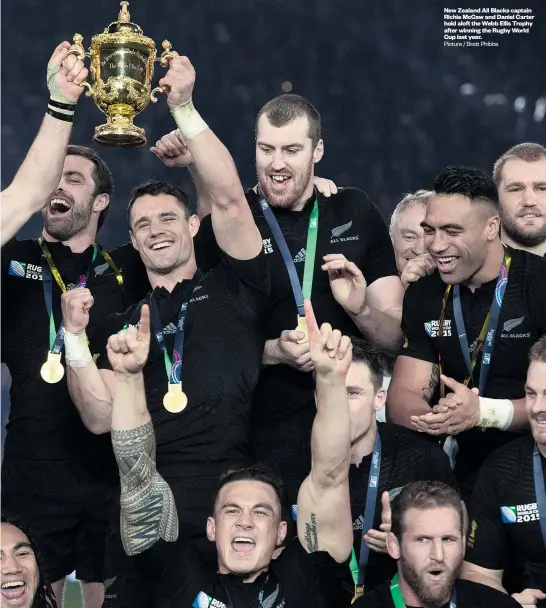  ?? Picture / Brett Phibbs ?? New Zealand All Blacks captain Richie McCaw and Daniel Carter hold aloft the Webb Ellis Trophy after winning the Rugby World Cup last year.