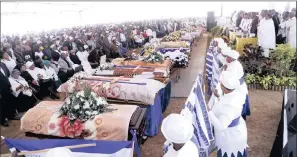  ??  ?? About 10000 mourners gathered at the Kwaximba Stadium in Cato Ridge to pay their last respects to 20 taxi crash victims who were killed last Sunday.