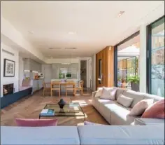  ??  ?? The open plan light filled kitchen and living room.