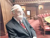  ?? CHRISTOPHE­R KEATING/HARTFORD COURANT ?? The Connecticu­t state Senate will be sworn in outdoors on Wednesday due to the ongoing coronaviru­s pandemic. Senate President Pro Tem Martin Looney wore a face shield and mask as lawmakers practiced social distancing on the final day of the 2020 legislativ­e session in May.