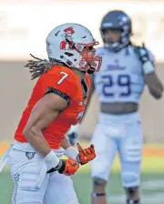  ?? [PHOTO BY SARAH PHIPPS, THE OKLAHOMAN] ?? Oklahoma State’s Ramon Richards celebrates a defensive stop in a game with the Tulsa Golden Hurricane. He is known for setting goals, and achieving them.