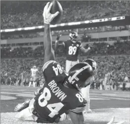  ?? DON WRIGHT, THE ASSOCIATED PRESS ?? Pittsburgh Steelers’ Antonio Brown holds a football high after scoring a touchdown against the New York Giants on Dec. 4.